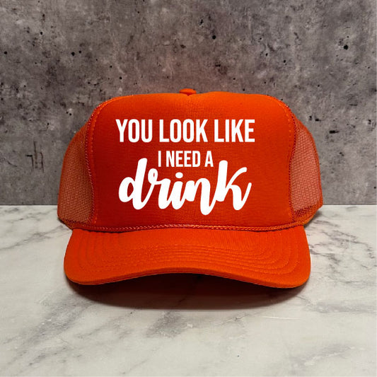 You look like I need a drink Trucker Hat